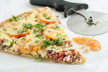 Classic homemade peace of pizza with pizza cutter