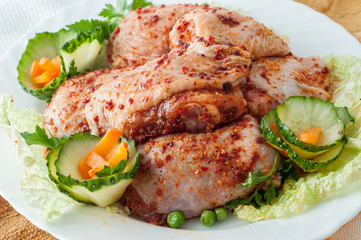 Raw marinade chicken wings with greens. Meat