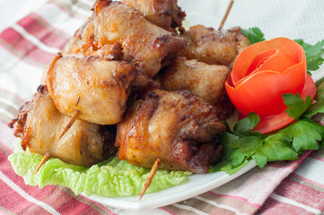 Chicken kebab with vegetables on the plate