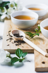 Green tea with a jasmine in white cups