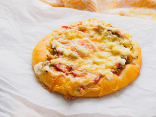 Homemade round classic russian pizza on a table