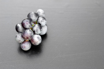 bunch of grapes on a dark background, top view