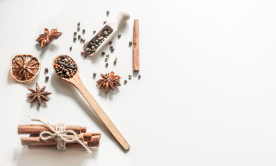 spices in a spoon isolated on white background,