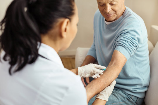 Professional Female Doctor Doing An Intravenous Injection