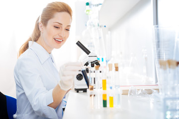 Positive delighted female taking test tube
