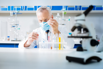 Confident lab assistant working with reagents