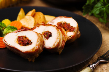 Delicious chicken rolls with dried tomatoes and mozzarella.