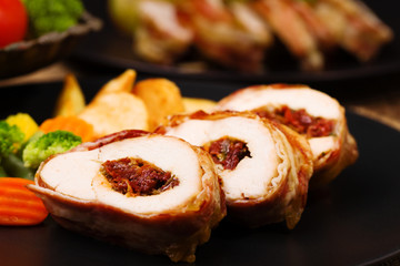 Delicious chicken rolls with dried tomatoes and mozzarella.