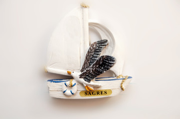 Sagre's souvenir: sail boat with a seagull flying. Portugal
