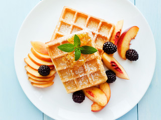 Belgium waffles with fruits and honey