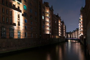 old warehouse district Speicherstadt in Hamburg, Germany illuminated at night