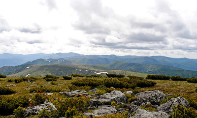 Summer mountain landscape. View of the hills and meadows on Lake Baikal, Russia