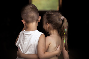 the little boy and girl hug
