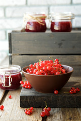 Red currant in bowl. Preservation of berries in glass jars