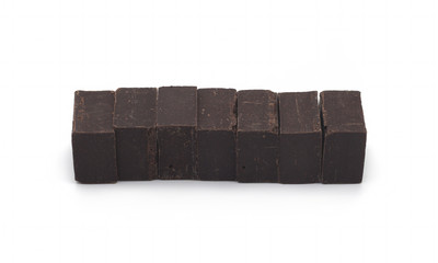 Chunks of chocolate isolated on white background