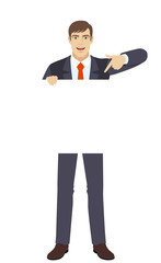 Businessman pointing finger at white blank poster