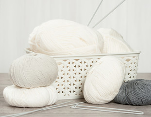 Fototapeta na wymiar Natural Wool Yarn Balls. Knitting Needles.