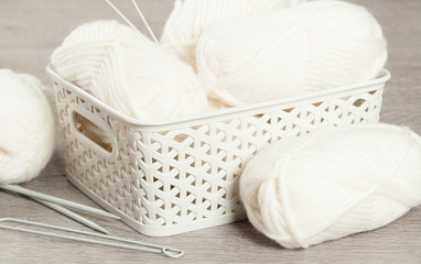 Obraz premium Natural Wool Yarn Balls. Knitting Needles.