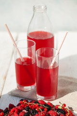 Drink of berries on a light background