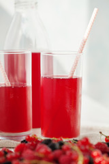 Drink of berries on a light background