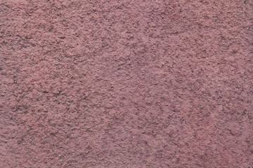 Brown painted stucco wall.