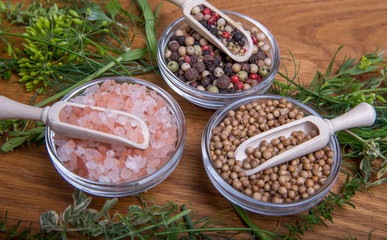 Vegetables, herbs and spices on an old wooden table, top view, copy space, rustic style. Vegetarian food, health or cooking concept