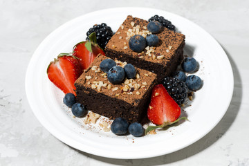 dessert - chocolate brownies with fresh berries on plate