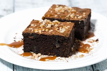 dessert - pieces of chocolate brownies with caramel sauce