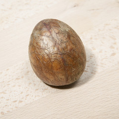 Avocado bone on a wooden board.