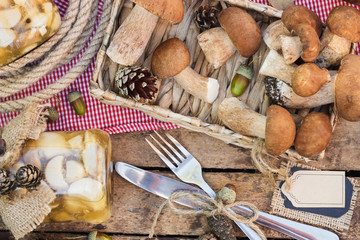 Raw white mushrooms, pine cones and tag for simple text