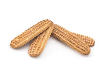 Biscuits, cane sugar, cinnamon sticks on white background