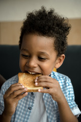 african american child eating toast