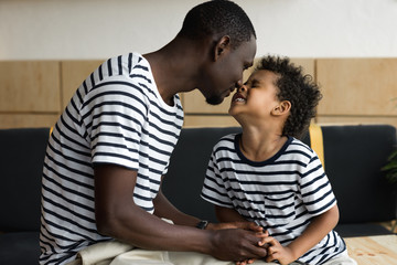 Obraz premium happy african american father and son