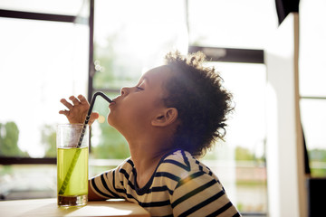 african american child drinking lemonade © LIGHTFIELD STUDIOS
