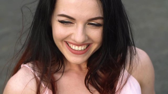 Portrait of young attractive girls smiling and looking at camera. Slow motion