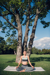 caucasian woman practicing lotus pose