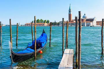 Pier with the gondola in Venice