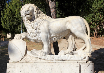 Ancient roman lion sculpture in park, Rome, Italy