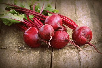 Fresh beetroot i on rustic wooden background. Harvest vegetable cooking conception . Diet or...