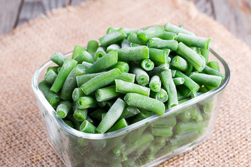 Frozen asparagus beans in a glass box