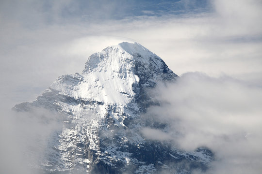 The summit of Eiger, over the clouds. Bernese Oberland, Switzerland
