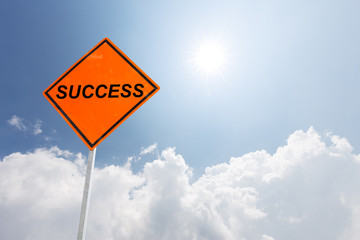 orange diamond traffic sign success in blue sunny sky