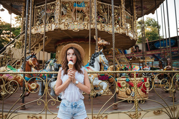 Young beautiful girl eating ice cream