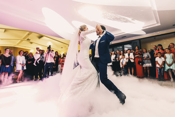 Stunning wedding couple dances tango as their first dance