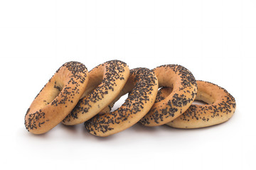 A delicious bagel with poppy seeds isolated on a white background