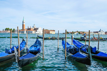 Fototapeta na wymiar Venice, Italy - July, 28, 2017: gondola on a Channel in Venice, Italy