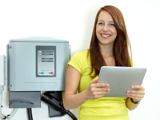 Woman loading electrically powered car 