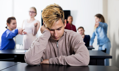 New boy student being shy among classmates