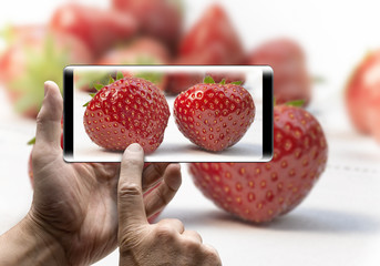 Holding a mobile Smartphone and take a picture