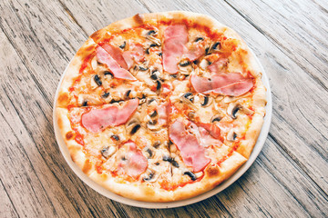 pizza on wooden background